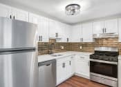 Thumbnail 4 of 24 - a kitchen with stainless steel appliances at Retro 511 Apartments, West Haven, CT