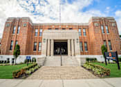 Thumbnail 1 of 24 - a large brick building with stairs in front of it