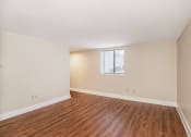 Thumbnail 16 of 24 - an empty living room with wood flooring and a window at Retro 511 Apartments, West Haven, CT