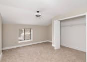 Thumbnail 9 of 24 - an empty bedroom with a closet and a window at Retro 511 Apartments, West Haven, CT