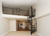 Thumbnail 10 of 24 - the loft in the great room of a house with a spiral staircase at Retro 511 Apartments, West Haven, 06516