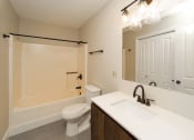Thumbnail 12 of 24 - a bathroom with a sink and a toilet and a shower at Retro 511 Apartments, West Haven