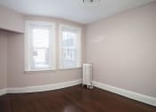 Thumbnail 29 of 55 - an empty room with a radiator and three windows at The Packard, Connecticut
