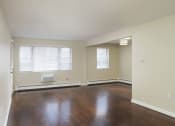 Thumbnail 33 of 55 - an empty living room with wood floors and a window at The Packard, West Hartford, Connecticut