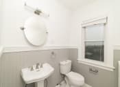 Thumbnail 27 of 55 - a white bathroom with a sink toilet and a window at The Packard, West Hartford, CT, 06119