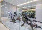 Thumbnail 37 of 41 - a gym with cardio equipment and glass walls at Up House, Connecticut