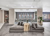 Thumbnail 18 of 41 - a lobby of an office building with couches and a table at Up House, Farmington, CT, 06032