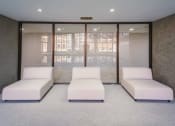 Thumbnail 31 of 41 - a room filled with white couches and a window at Up House, Farmington