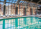 Thumbnail 17 of 41 - a swimming pool in front of a building with large windows at Up House, Connecticut, 06032