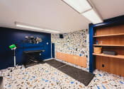 Thumbnail 12 of 41 - a recording studio with blue walls and a white and blue tile floor at Up House, Farmington, CT