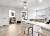 Thumbnail 3 of 37 - an open kitchen and living room with a white counter top at The Meriden, Meriden