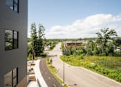 Thumbnail 11 of 23 - a view from a building of a road and a river