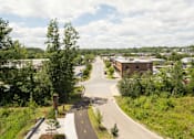 Thumbnail 33 of 33 - A road with a yellow line in the middle of it.
