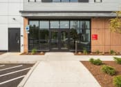 Thumbnail 33 of 41 - the front entrance of a building with glass doors