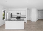 Thumbnail 17 of 30 - A modern kitchen with white cabinets and a large island.