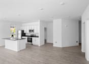 Thumbnail 22 of 30 - A modern kitchen with a large island and wooden floors.