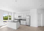 Thumbnail 25 of 30 - A modern kitchen with white cabinets and a large island.