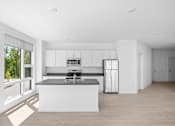 Thumbnail 23 of 30 - A modern kitchen with a large island and stainless steel appliances.
