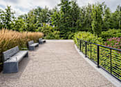 Thumbnail 30 of 42 - a series of benches sit on a concrete platform with a black railing