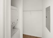 Thumbnail 28 of 30 - A white dryer is in a small room with a white wall and a white door.