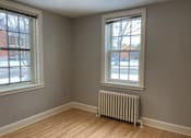 Thumbnail 16 of 24 - A room with a window and a radiator on the floor.