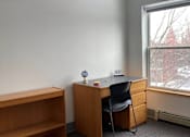 Thumbnail 9 of 15 - a desk and a chair in a room with a window