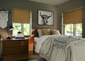 Thumbnail 4 of 15 - a bedroom with a bed and a picture of a bull