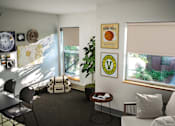 Thumbnail 1 of 15 - a living room with a table and chairs and a window