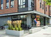 Thumbnail 32 of 33 - A building with a sign that says "Breakfast Dinner" on it.