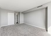 Thumbnail 103 of 151 - A room with a carpeted floor and a white door.