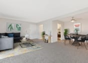 Thumbnail 1 of 38 - a living room and dining room with a table and chairs