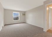 Thumbnail 10 of 38 - an empty room with carpet and a window