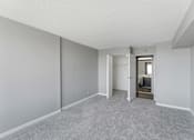 Thumbnail 144 of 151 - A room with a carpeted floor and white walls.