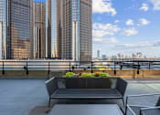Thumbnail 63 of 151 - A cityscape with tall buildings and a clear sky.