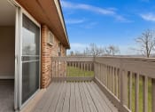 Thumbnail 31 of 38 - the deck of a home with a sliding glass door