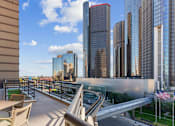 Thumbnail 58 of 151 - A cityscape with tall buildings and a clear sky.