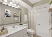 Thumbnail 4 of 38 - a bathroom with a sink toilet and a shower