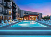 Thumbnail 76 of 82 - a swimming pool at dusk