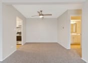 Thumbnail 8 of 38 - an empty living room with a ceiling fan