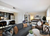 Thumbnail 3 of 32 - a living room with a couch and a bed