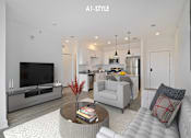 Thumbnail 1 of 46 - A modern living room with a white couch and a coffee table.
