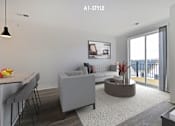 Thumbnail 2 of 46 - A modern living room with a grey sofa and a dining table.