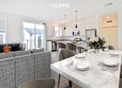 Thumbnail 10 of 46 - A modern dining room with a white marble table set for two.