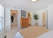 Thumbnail 22 of 46 - a bedroom with a bed and a closet
