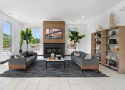 Thumbnail 42 of 46 - a living room with couches and a table and a fireplace