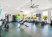 Thumbnail 44 of 46 - the gym has plenty of exercise equipment and windows