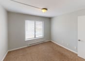 Thumbnail 23 of 46 - an empty room with a window and a door
