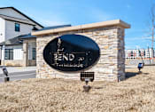 Thumbnail 25 of 27 - A sign that says Bend on Promenade in front of a building.