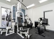 Thumbnail 22 of 40 - fitness center with adjustable weight lifting equipment