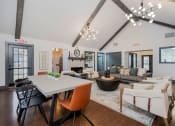 Thumbnail 29 of 40 - apartment club house lounge with long table and lounge seating